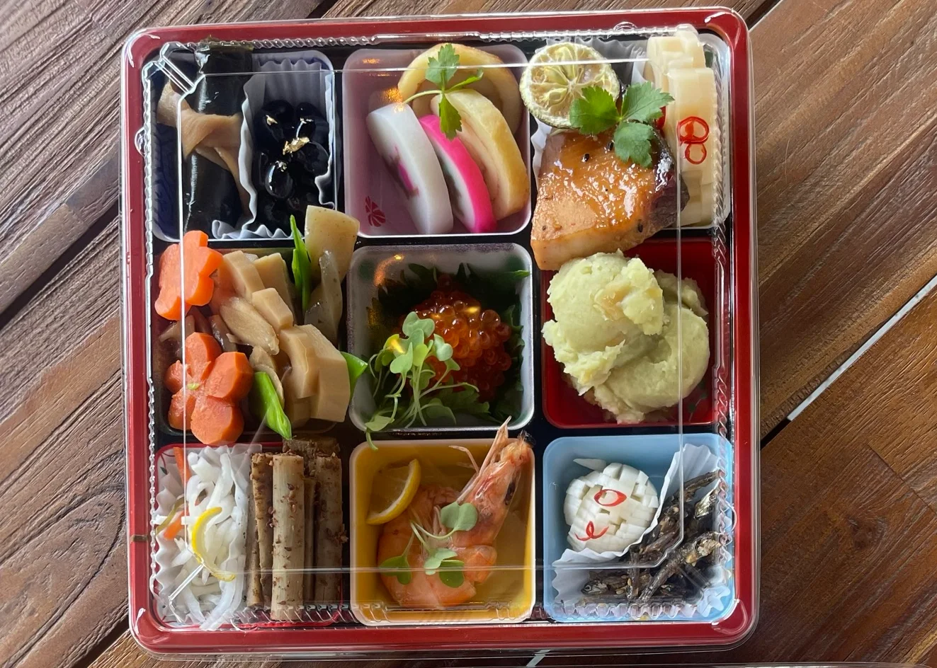 Japanese bento box featuring assorted delicacies