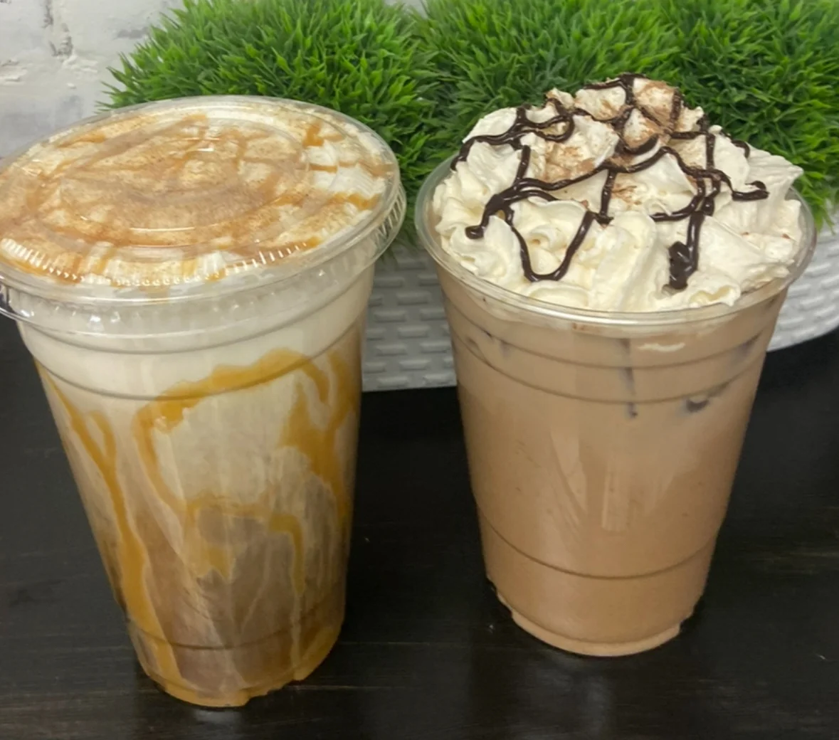 Iced caramel and mocha coffee drinks topped with whipped cream