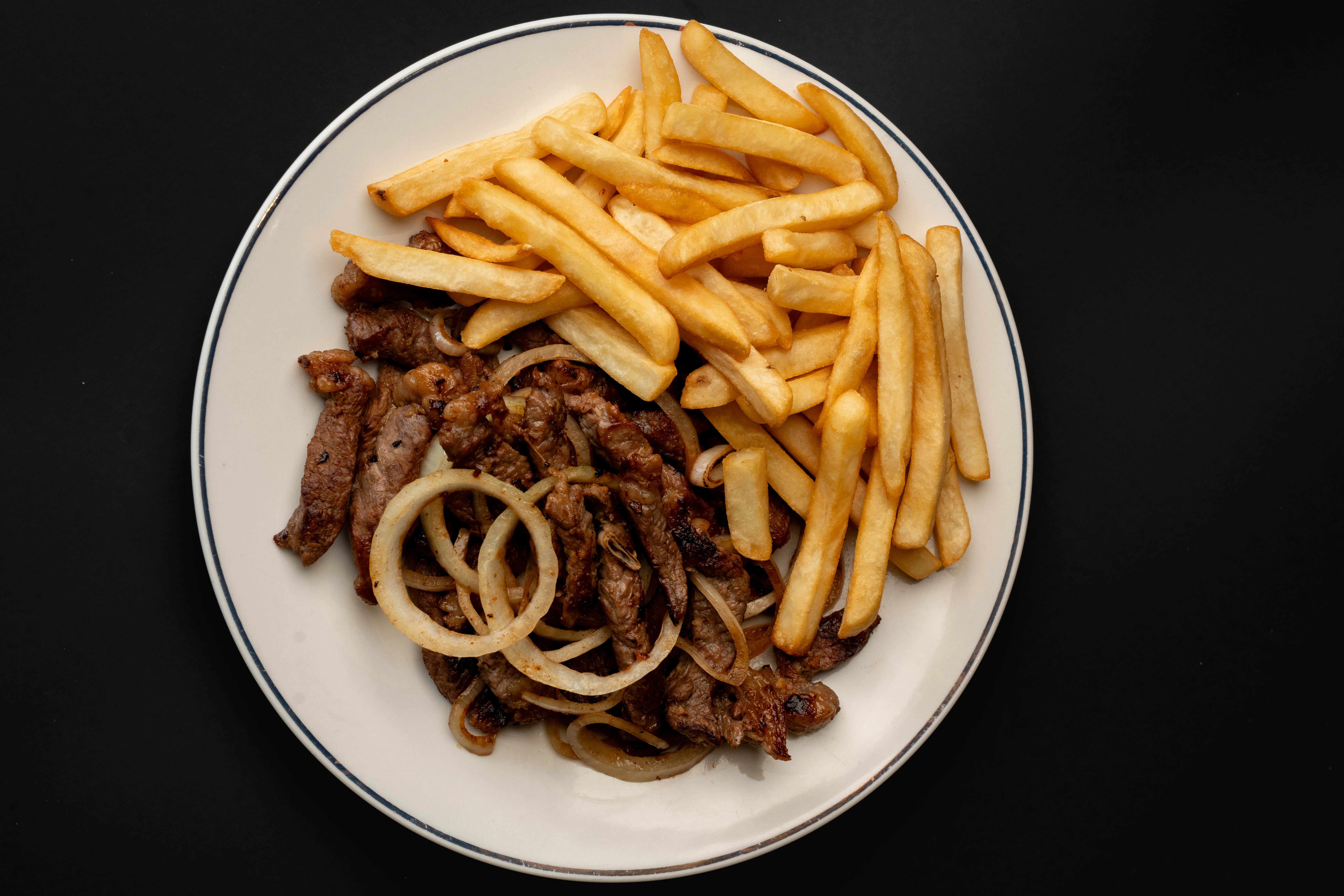 Grilled steak fajitas with crispy fries