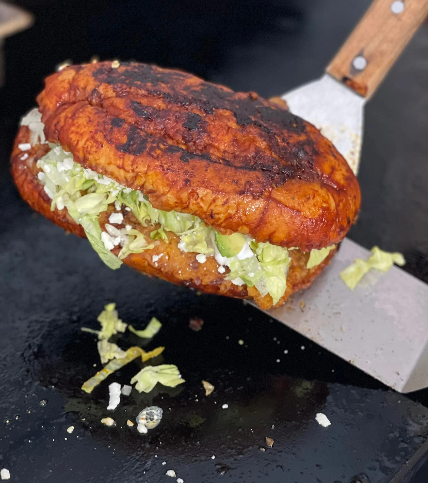 Delicious Venezuelan arepa filled with fresh lettuce and cheese