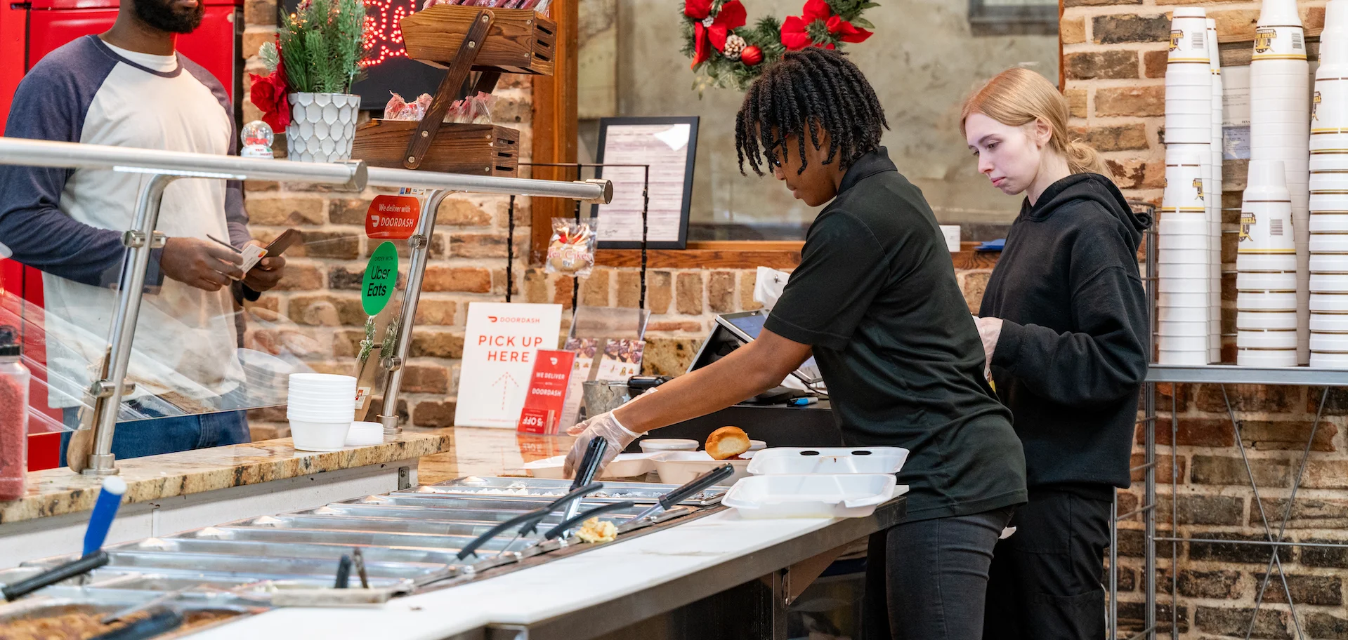 Texas Best workers serving customer