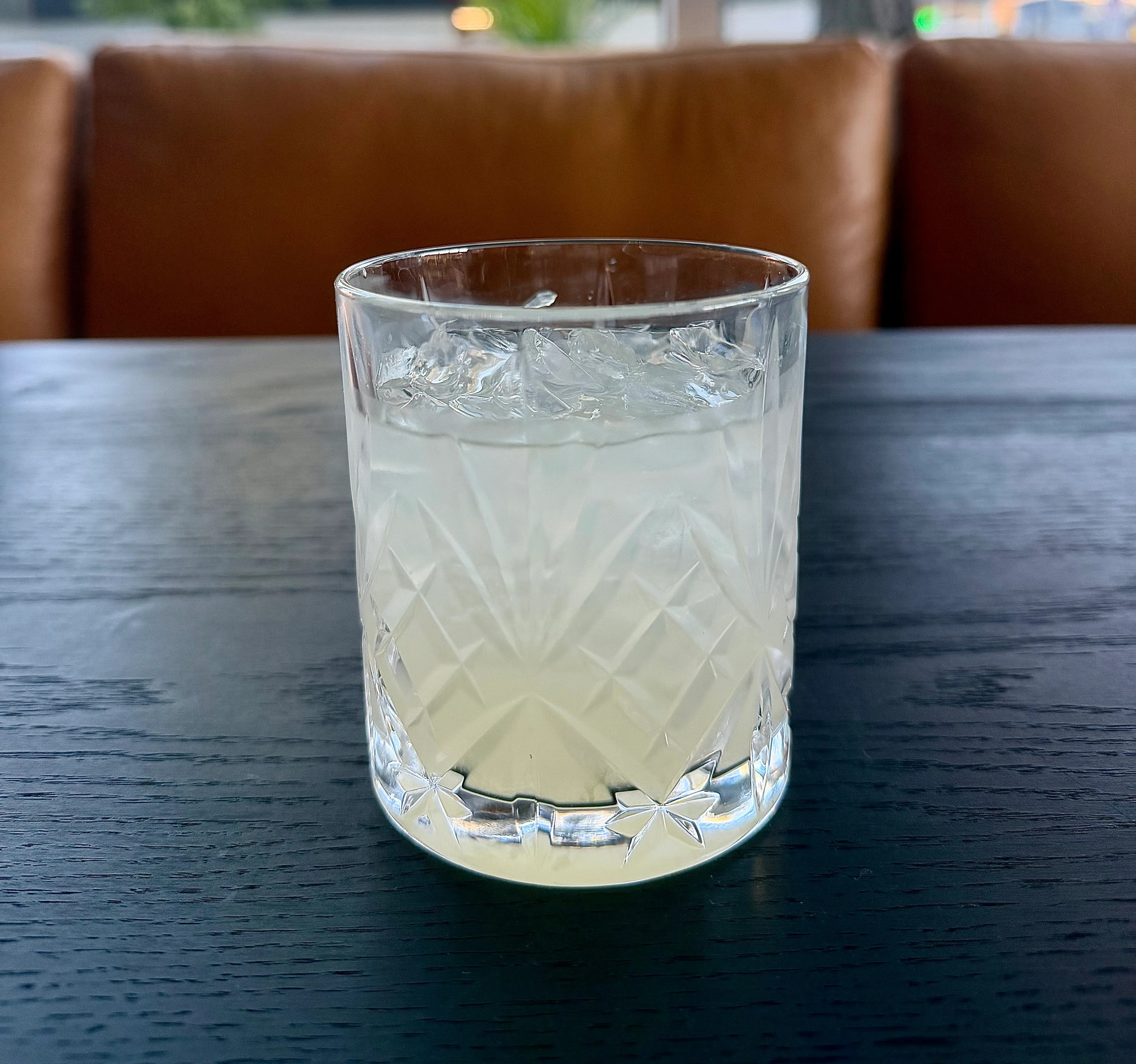 Refreshing cocktail served in a crystal glass with ice