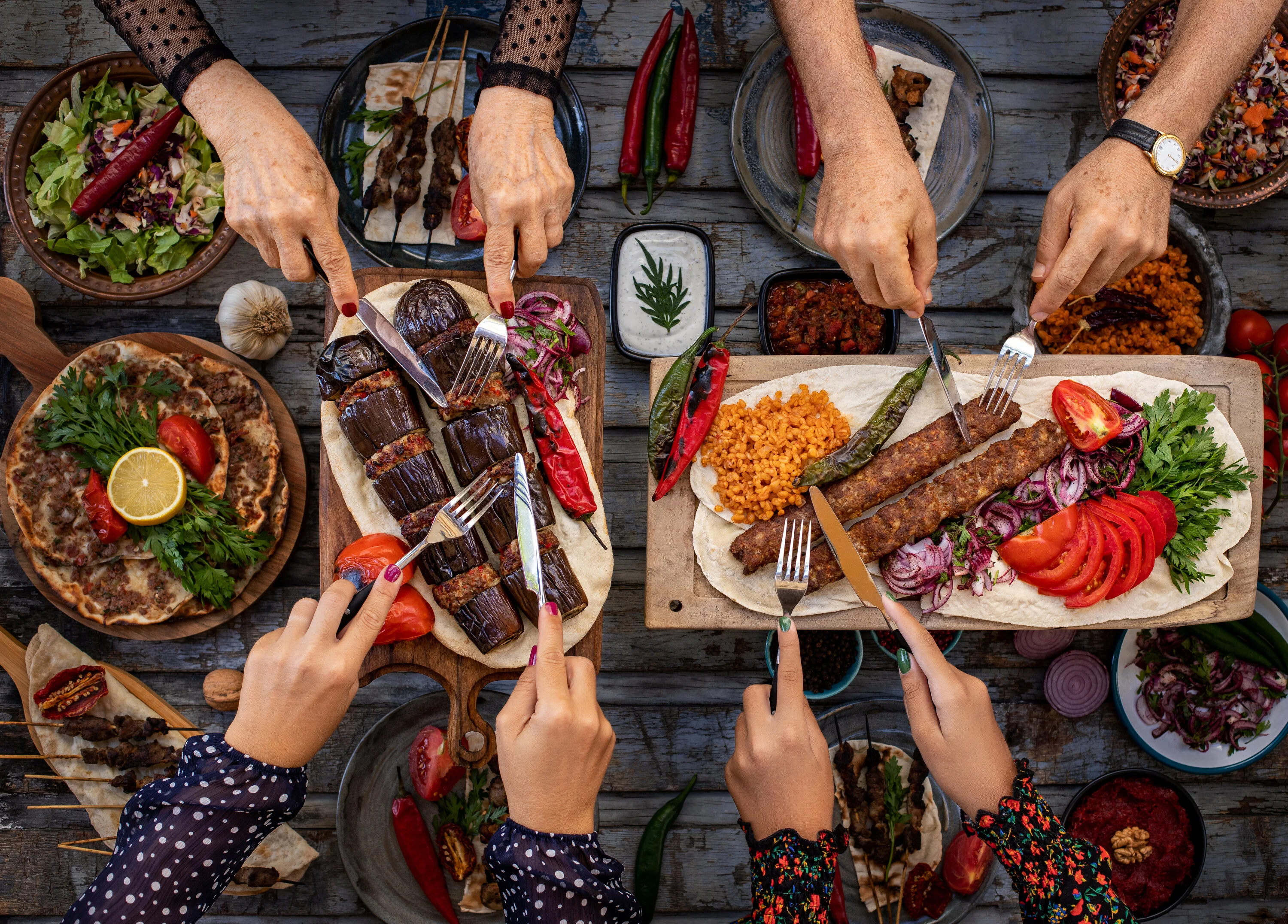 Turkish kebab platter with grilled vegetables and fresh herbs