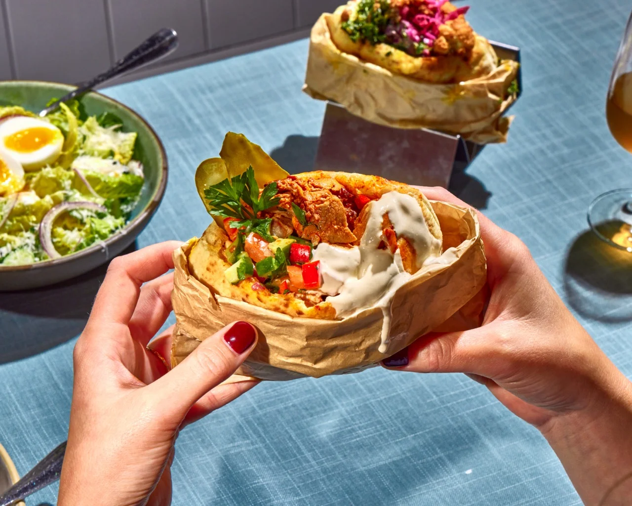 Delicious Mexican taco al pastor served in a paper wrap
