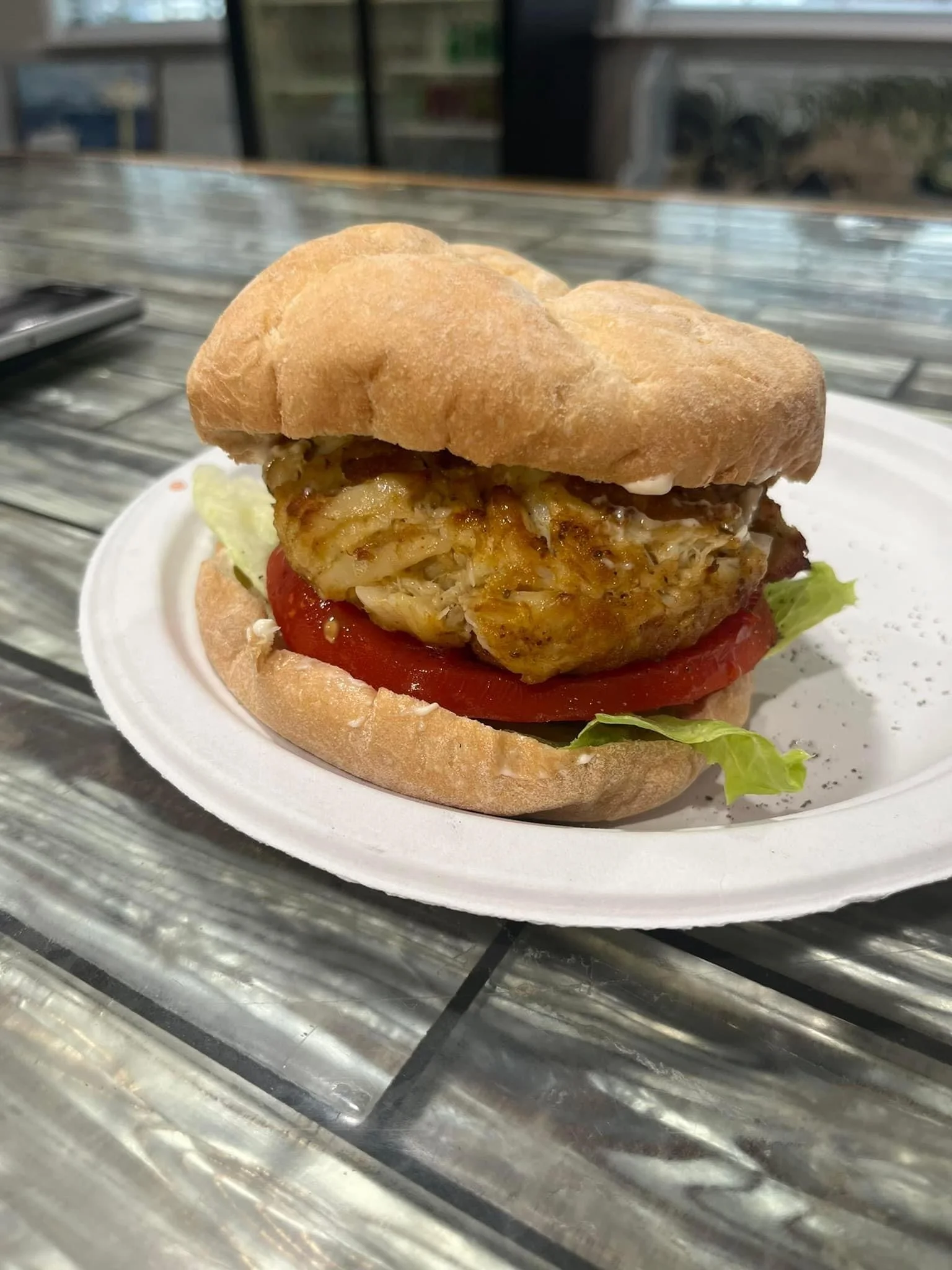 Crab cake sandwich with lettuce and tomato
