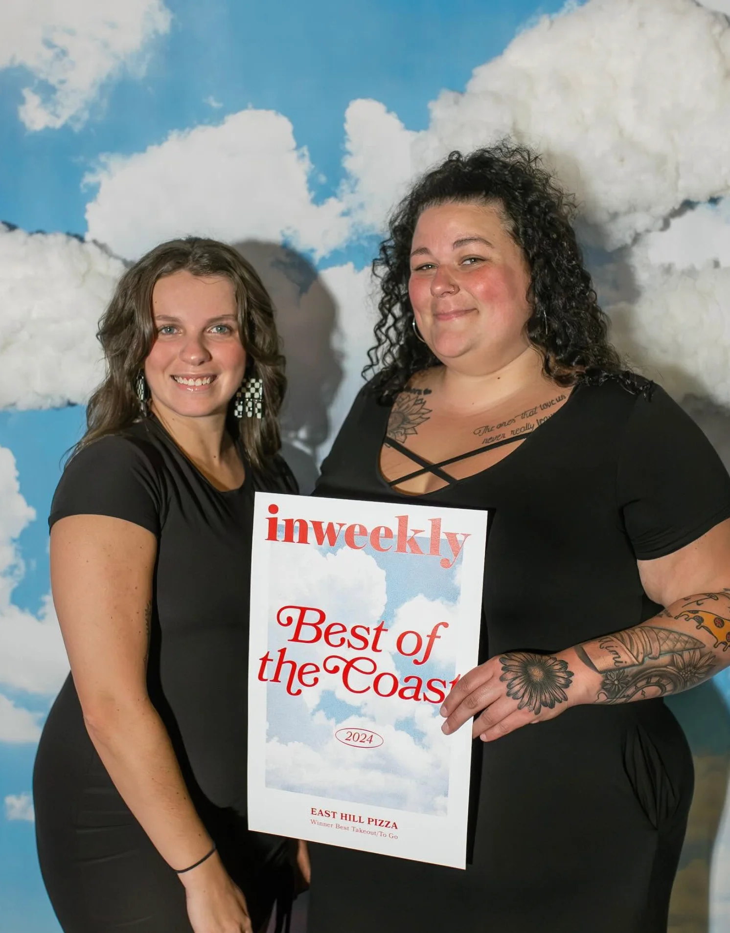 Restaurant team holding a Best of the Coast award certificate