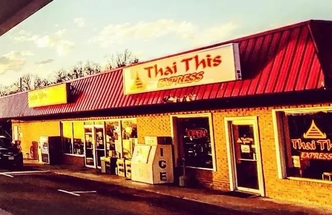 Exterior view of Thai This Express restaurant at sunset