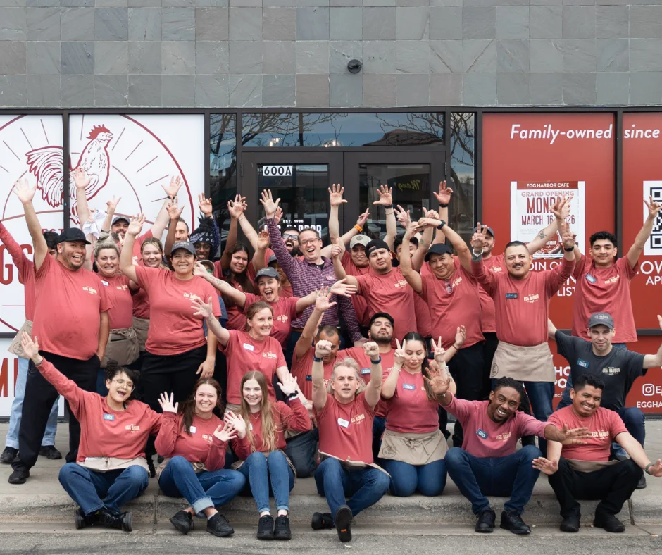 Team celebration at a family-owned restaurant grand opening