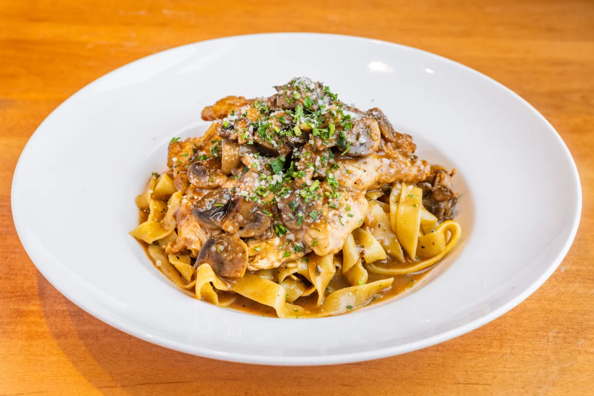 Chicken paprikash served over egg noodles