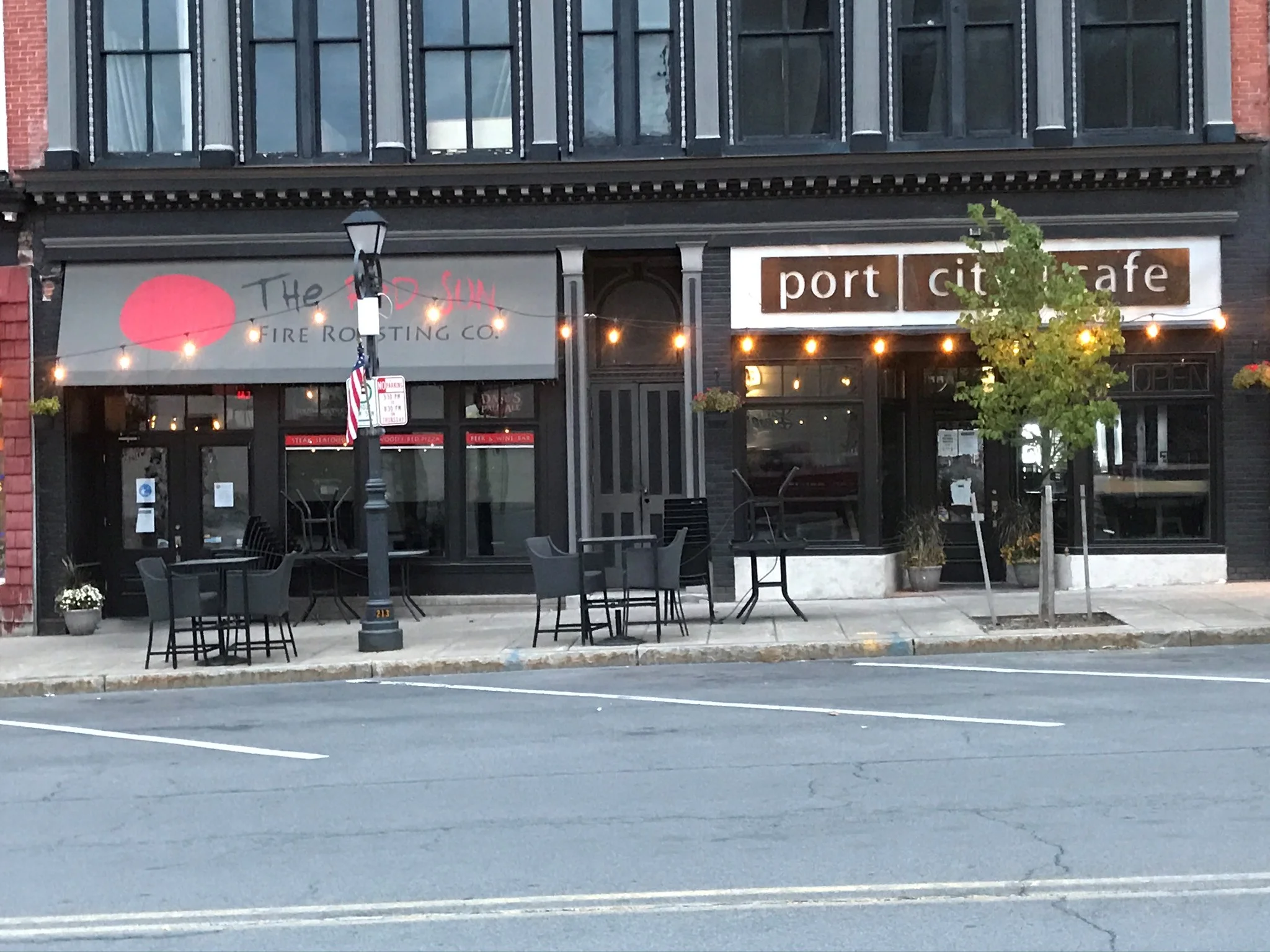 Charming restaurant exterior with outdoor seating and warm lighting