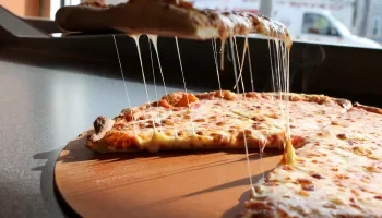 Cheesy Margherita pizza with gooey mozzarella