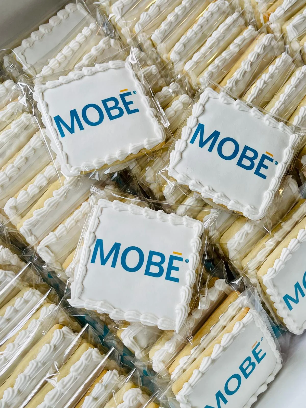 Decorative cookies with MOBE logo in clear packaging