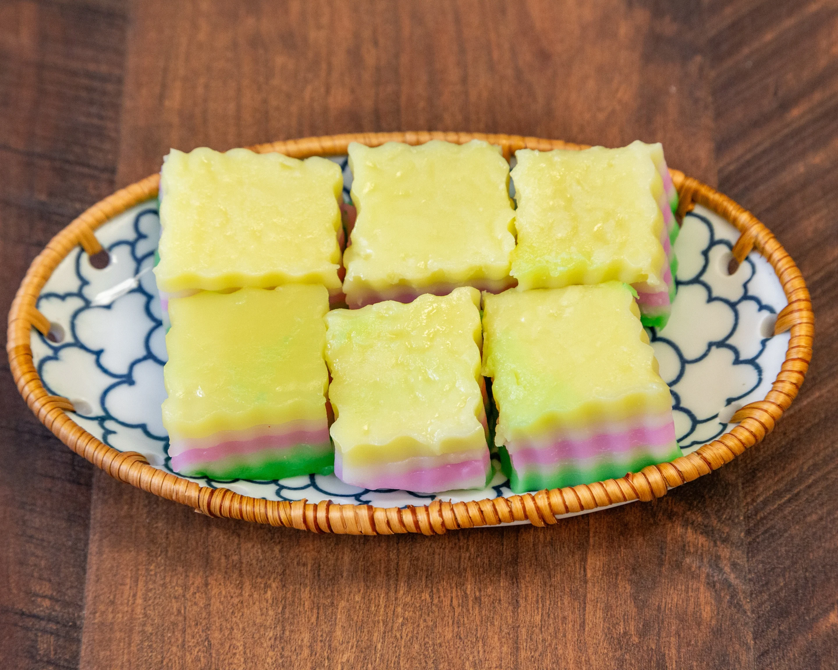 Colorful Malaysian kuih lapis served on a decorative plate