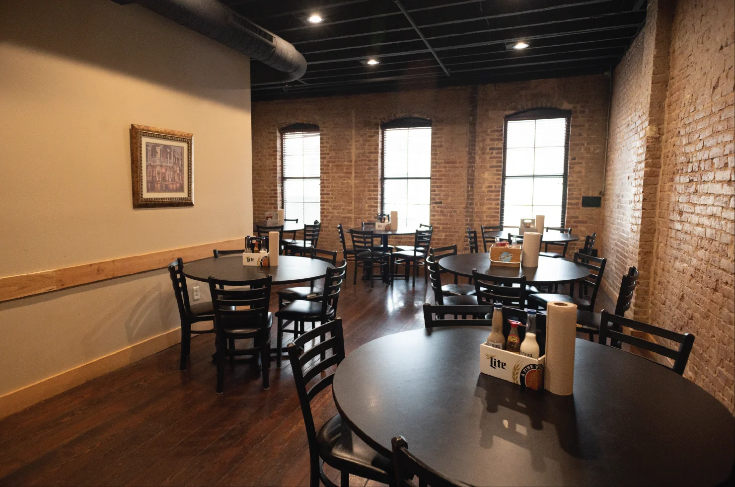 Cozy restaurant interior with rustic brick walls and wooden tables