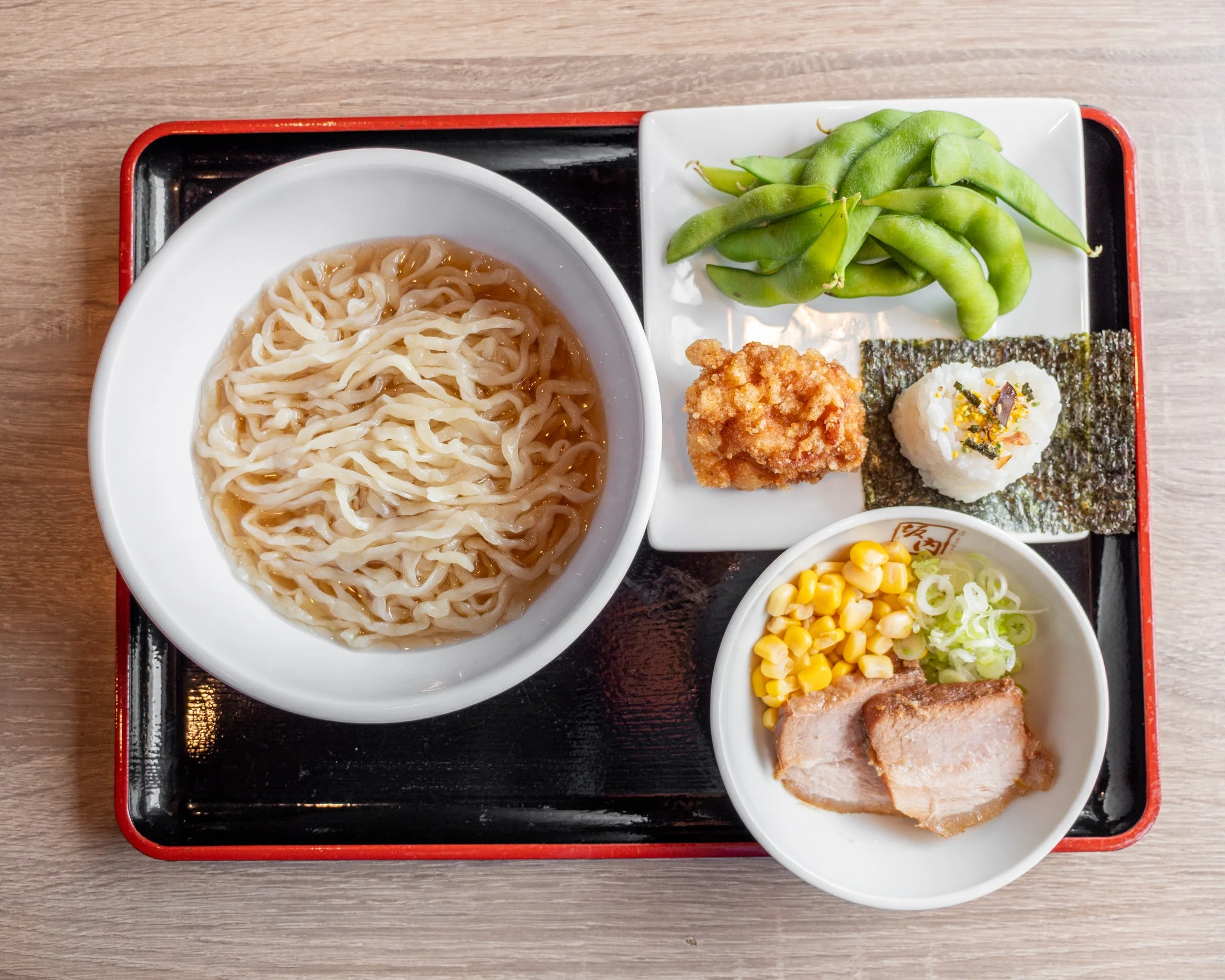 plain ramen, sushi, fried chicken, edamame, corn, meat slice