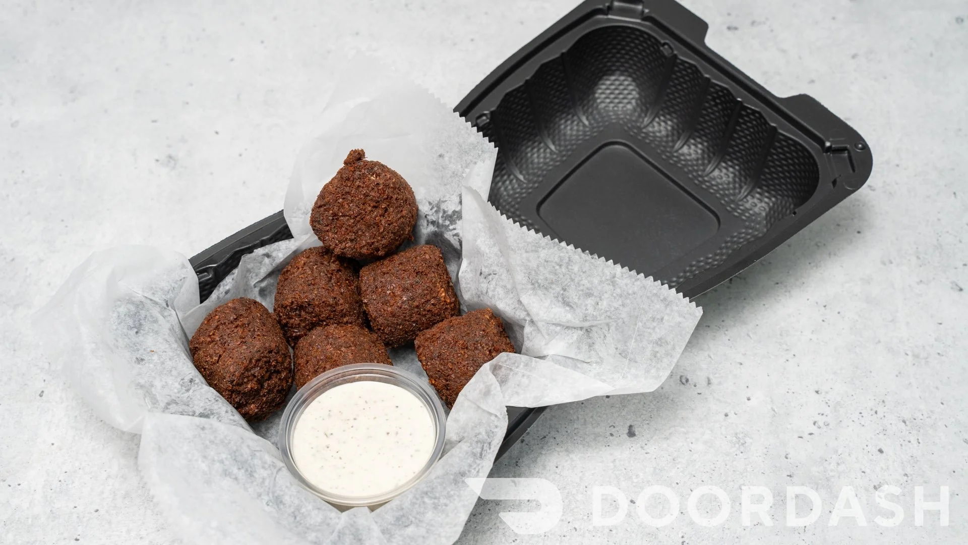 Crispy falafel balls served with dipping sauce