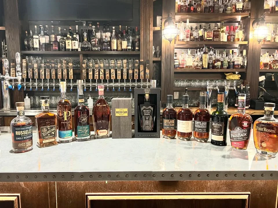 Selection of premium whiskey bottles on a bar counter