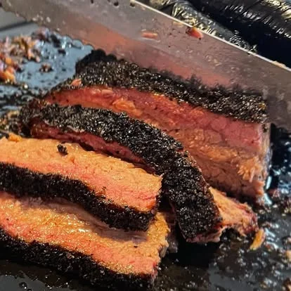 Smoked brisket slices with a flavorful bark