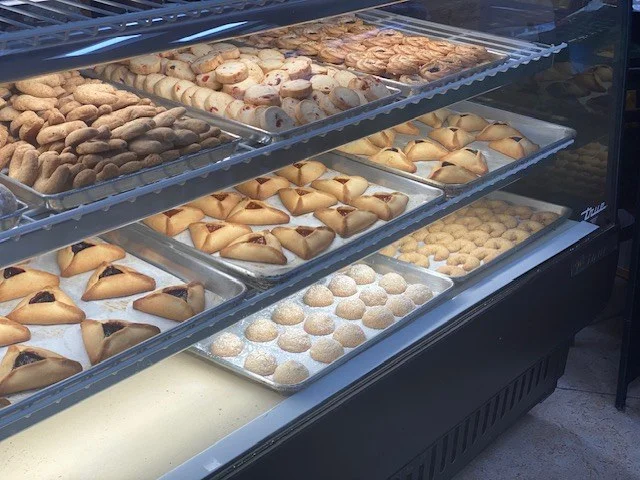 Cookies, hamantaschen and pastries in the bakery case at The Kosher Pastry Oven