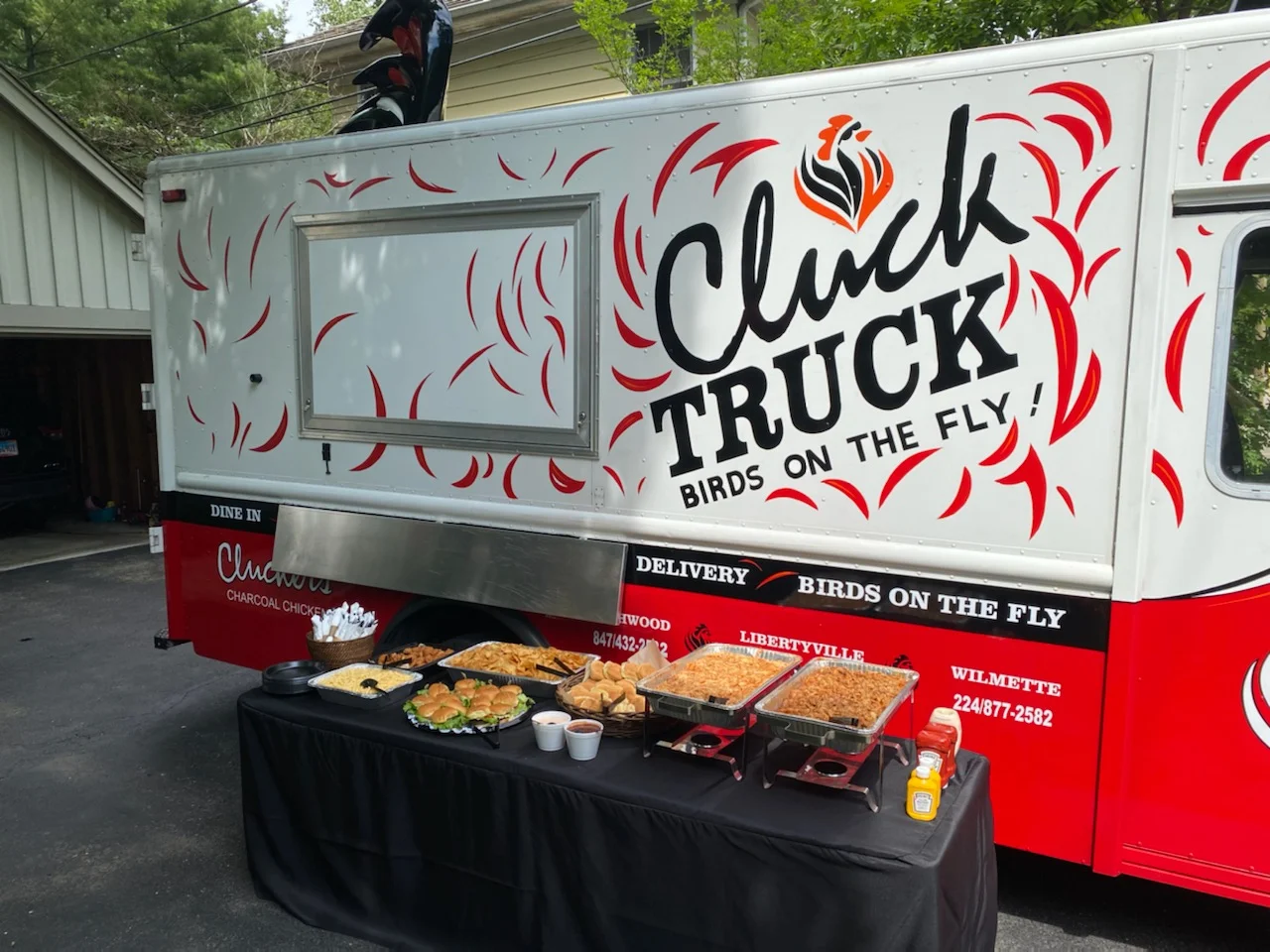 Food truck serving charcoal chicken and sides