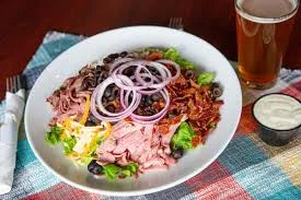 Hearty chef salad with assorted meats and fresh vegetables