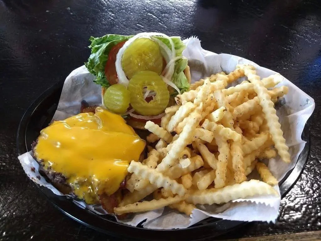 Classic American cheeseburger with crinkle-cut fries