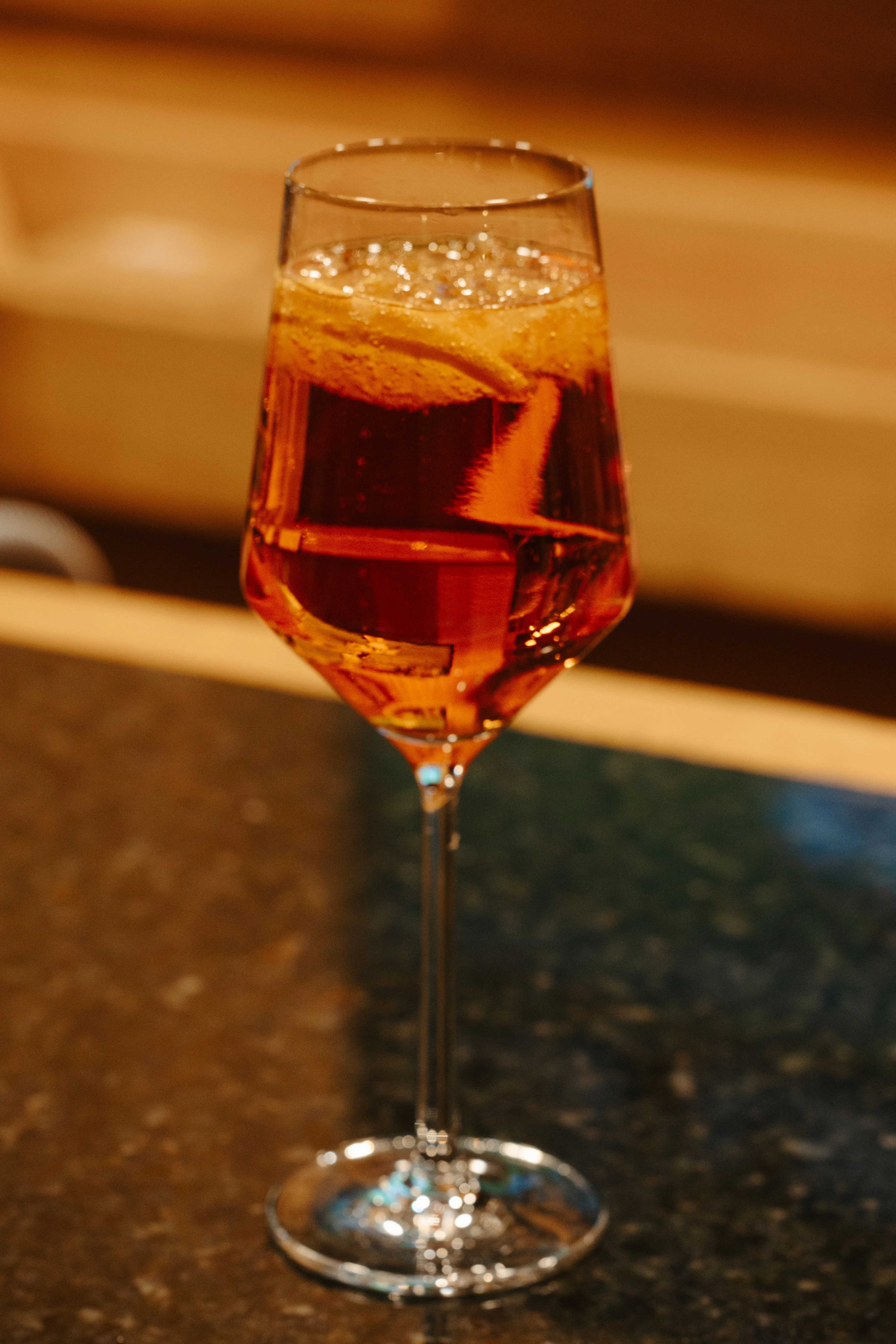 Elegant cocktail served in a tall glass with bubbles