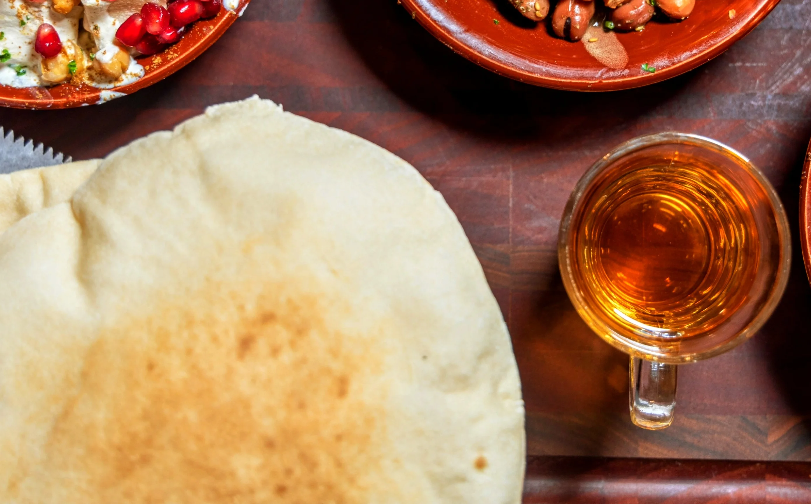 Middle Eastern feast with shawarma, falafel, and tea