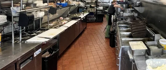 A restaurant chef preparing a dish