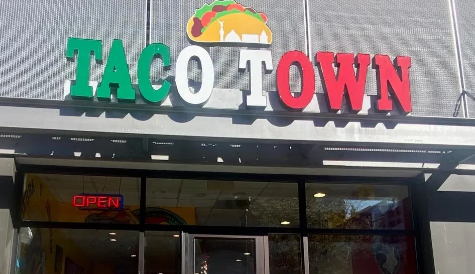 Exterior view of Taco Town restaurant with vibrant signage