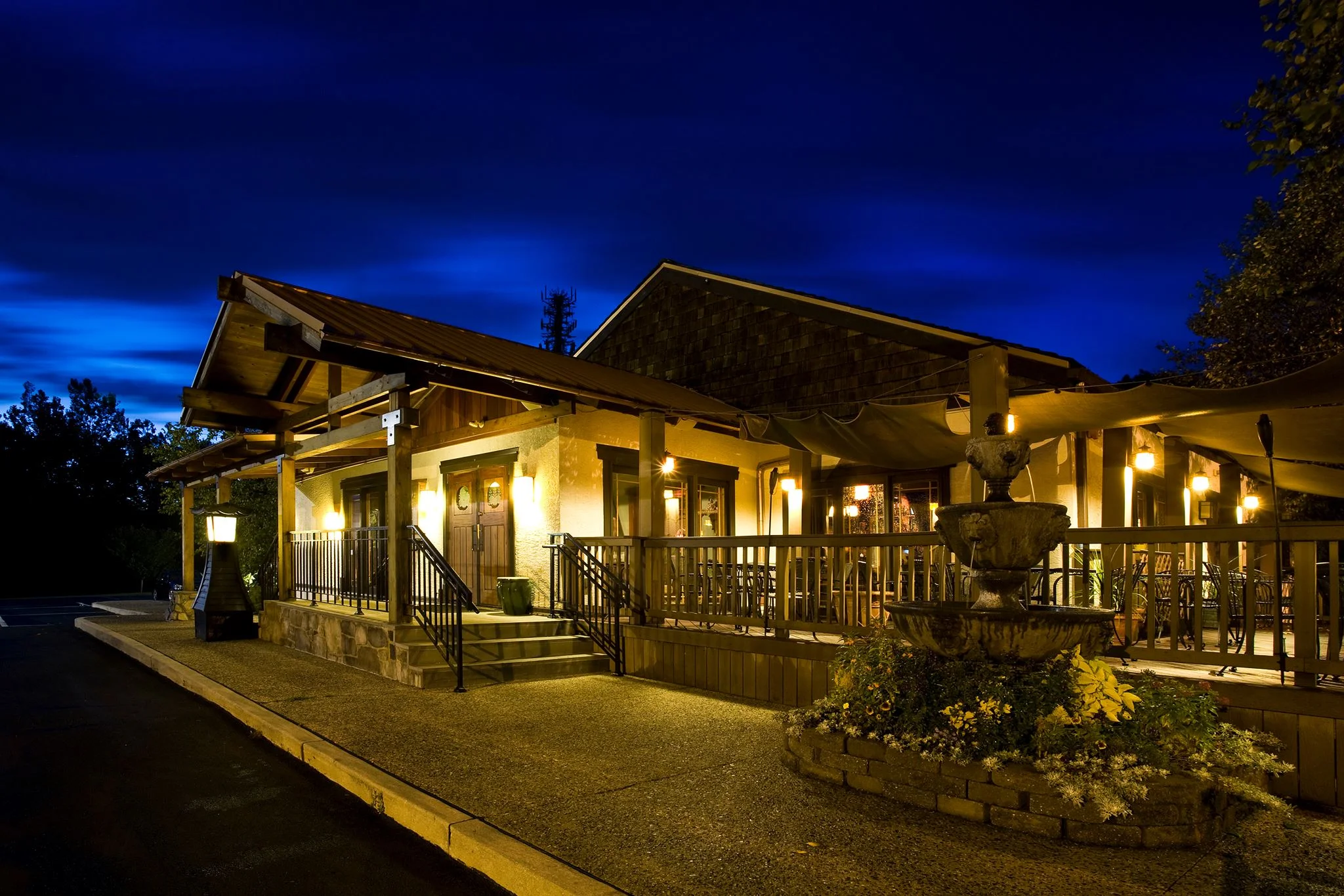 Charming restaurant exterior at night with warm lighting