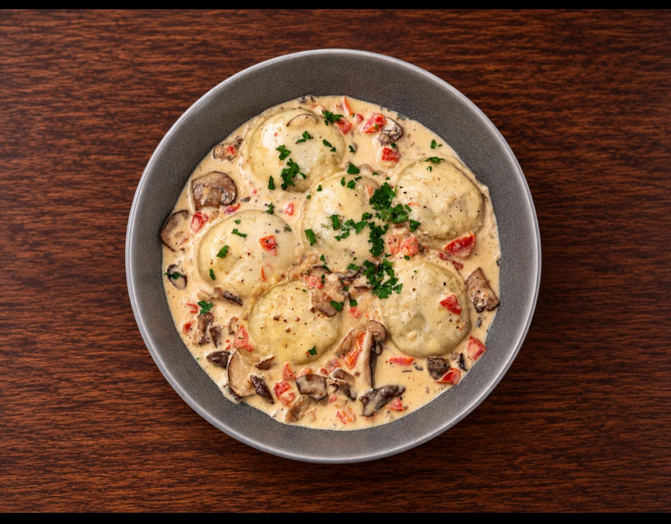 Delicious Italian ravioli in creamy mushroom sauce