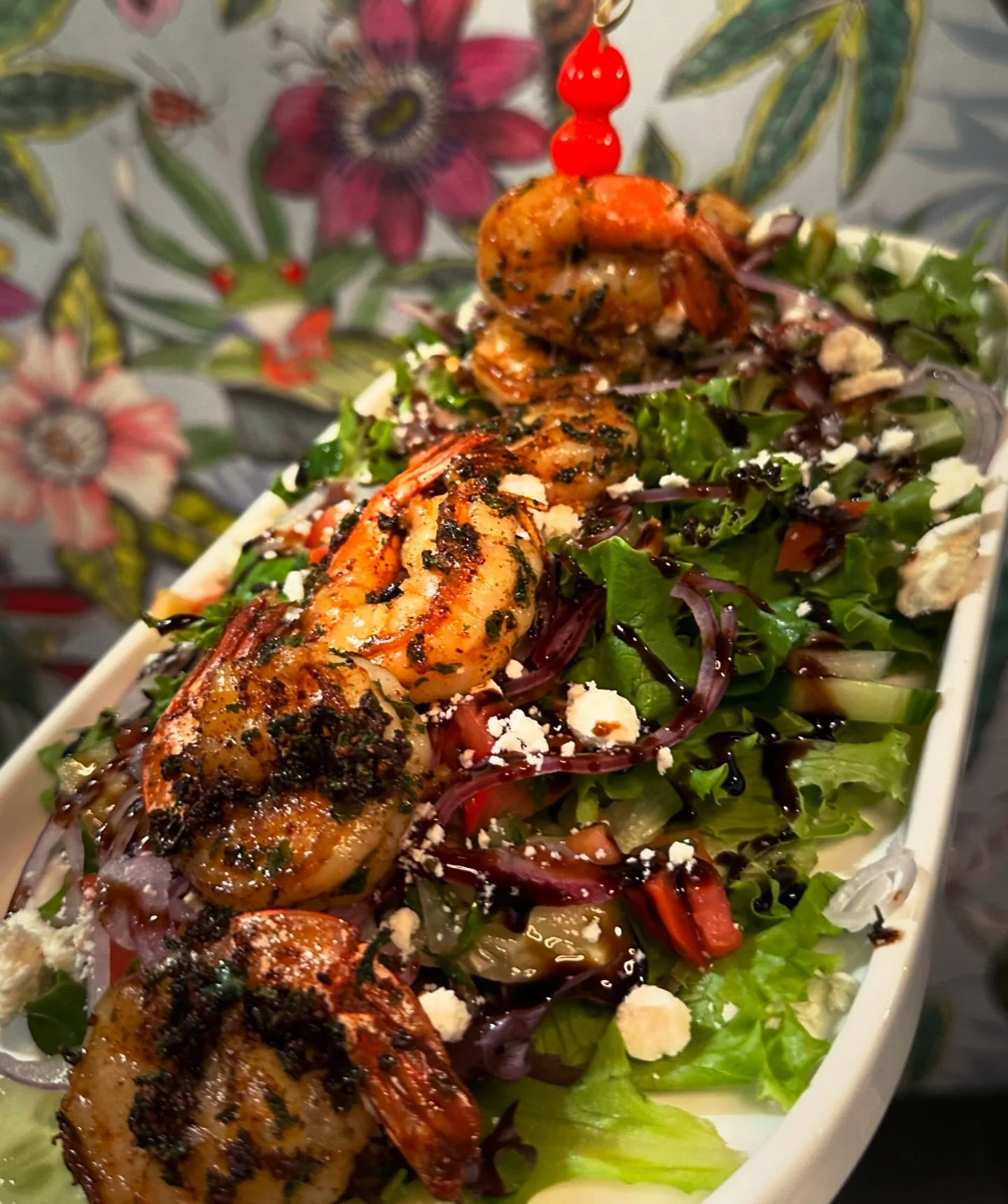 Grilled shrimp salad with fresh greens and vegetables