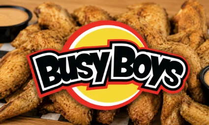 Crispy chicken wings with dipping sauce and restaurant logo