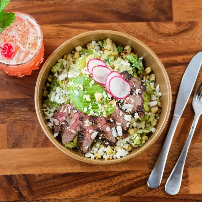 Grilled steak salad with avocado and radishes