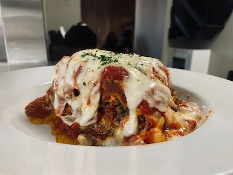 Italian lasagna layered with melted cheese and tomato sauce