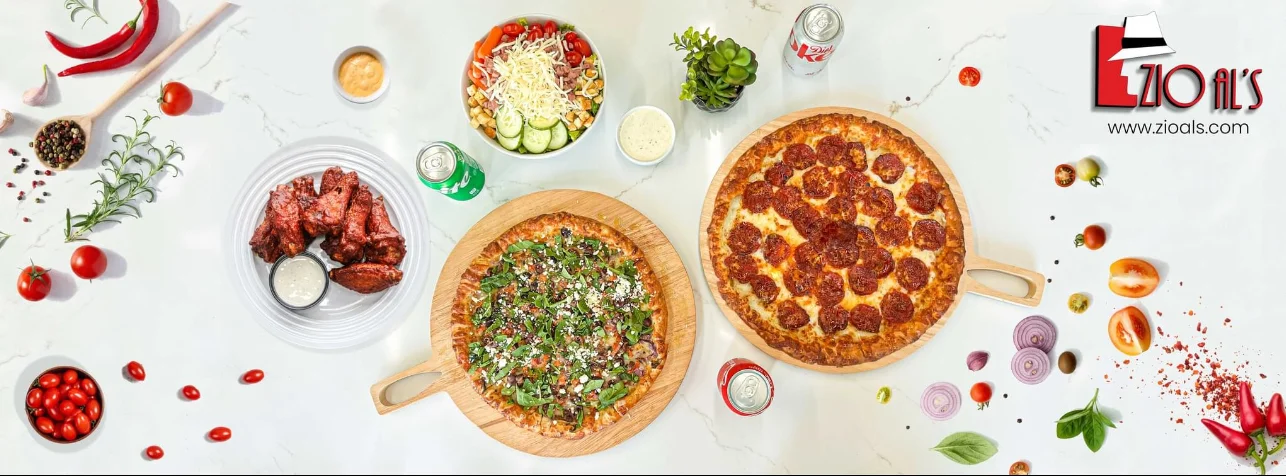Delicious pepperoni pizza and wings in a vibrant restaurant setting