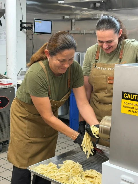 Pasta making workshop with fresh pasta dishes and ingredients