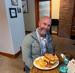 Delicious cheeseburger with fries in a cozy restaurant setting