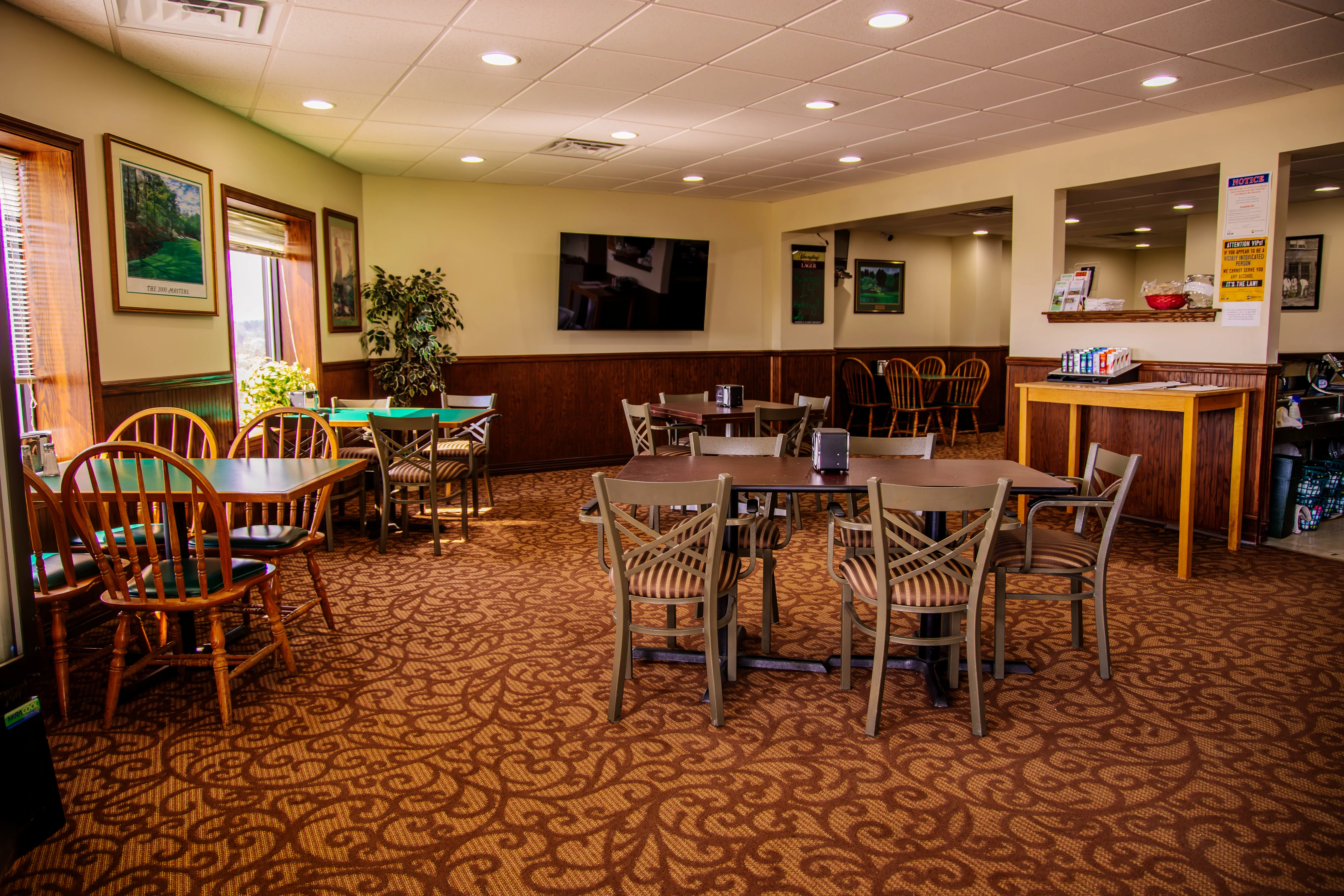 Cozy restaurant interior with wooden tables and warm lighting