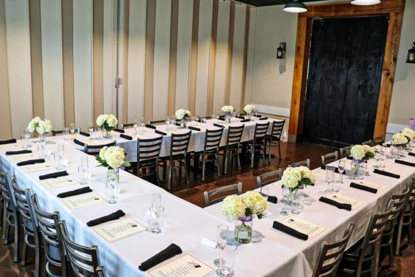 Elegant dining setup with floral centerpieces and menus