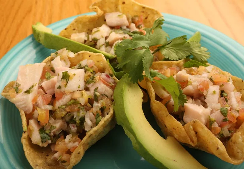 Ceviche served in crispy tortilla cups