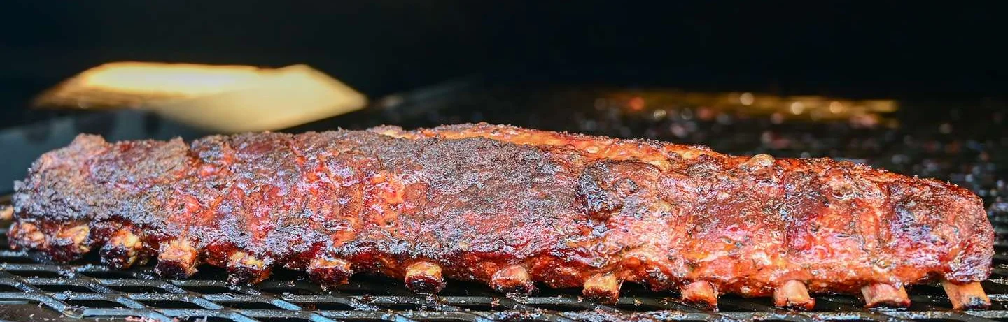 Smoked barbecue ribs on a grill