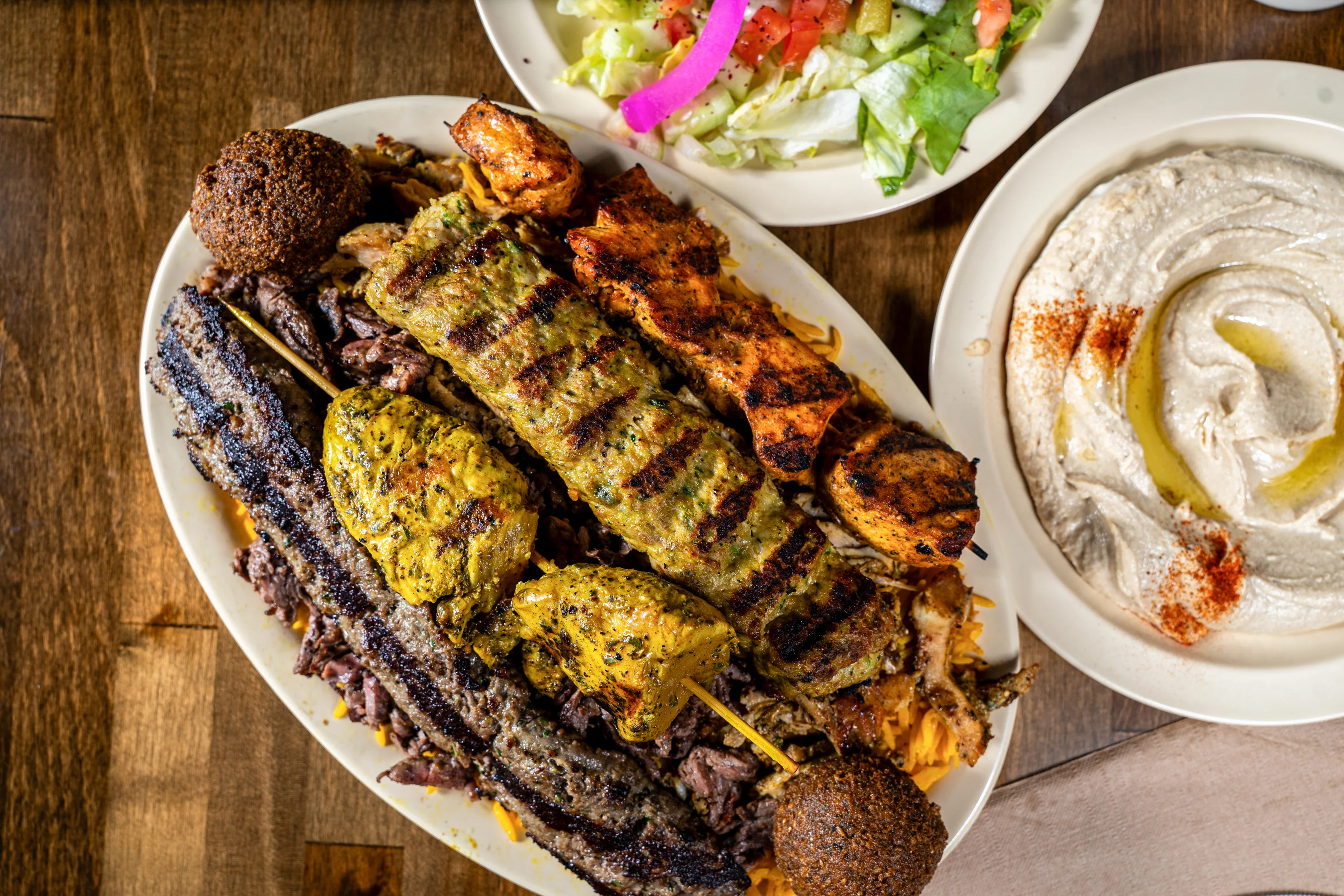 Pita Zone mixed grilled kababs with rice and Mediterranean sides