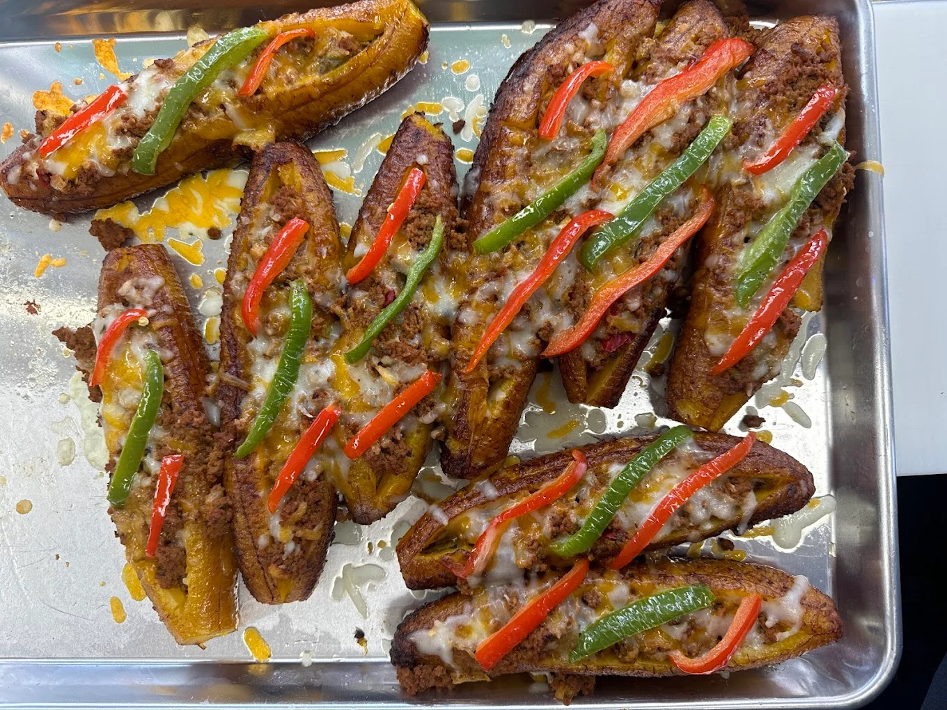 Baked stuffed plantains with ground beef and peppers