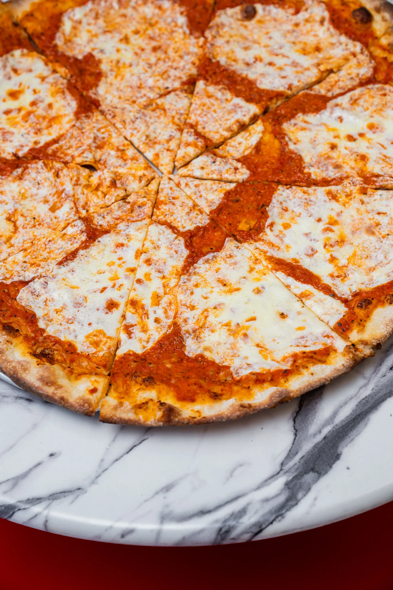 Classic Margherita pizza on a marble serving board