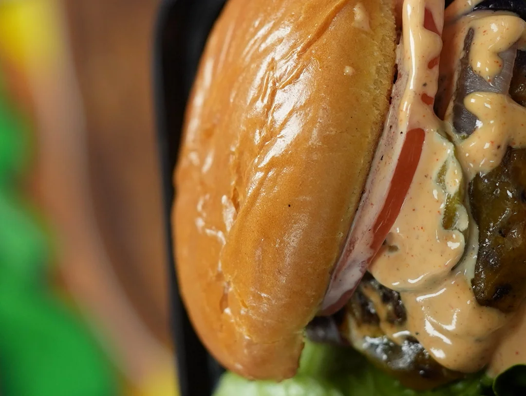 Juicy cheeseburger with special sauce and fresh toppings