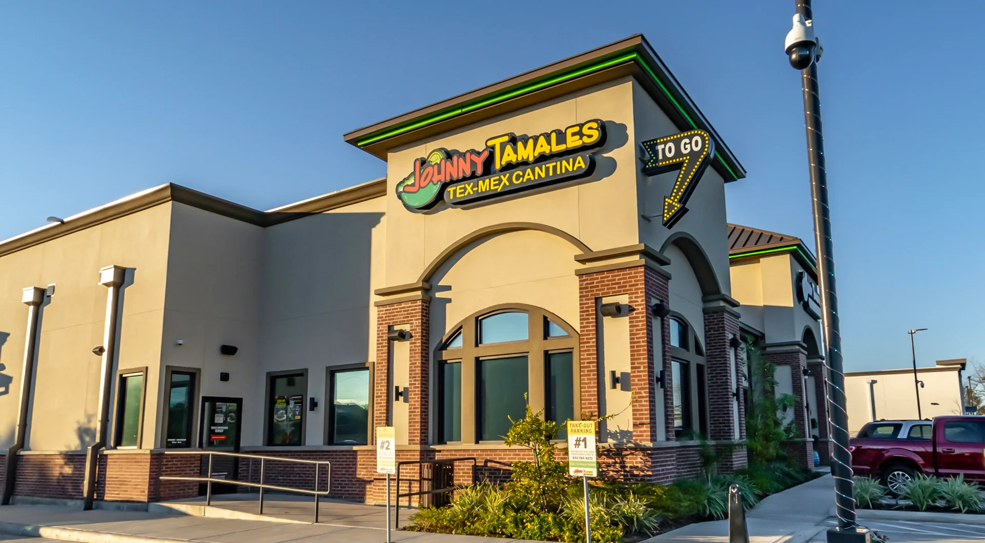 Exterior view of a Tex-Mex restaurant with vibrant signage
