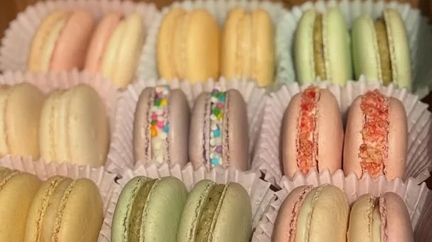 Colorful French macarons in a pastry box