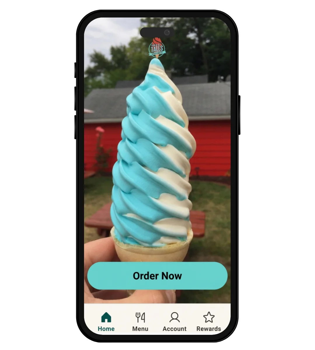 Swirled soft serve ice cream cone in vibrant blue and white